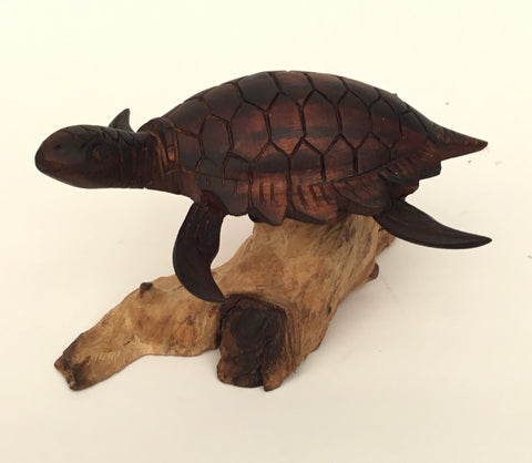 DARK CARVED TURTLE ON WOOD